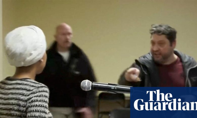 Security tackles man who sprayed unidentified liquid on Ilhan Omar at town hall – video | Ilhan Omar